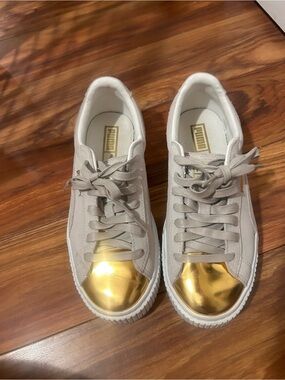 Puma Women's White Sneakers with Metallic Gold Toe